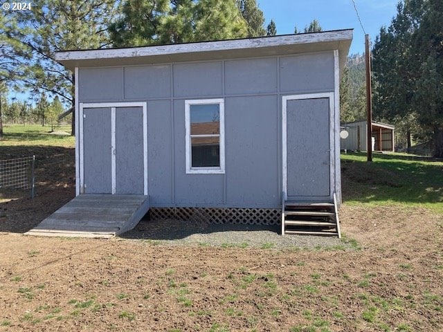 view of outdoor structure with a yard