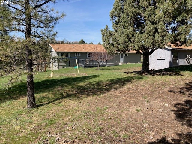 view of yard with a wooden deck