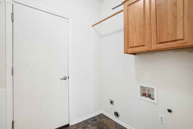 washroom featuring hookup for a washing machine, cabinets, and electric dryer hookup