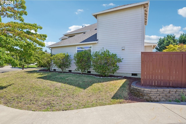 view of home's exterior featuring a yard