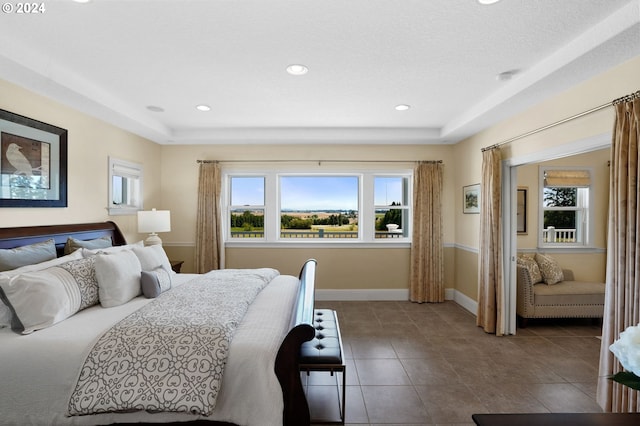 bedroom with tile patterned flooring, recessed lighting, and baseboards