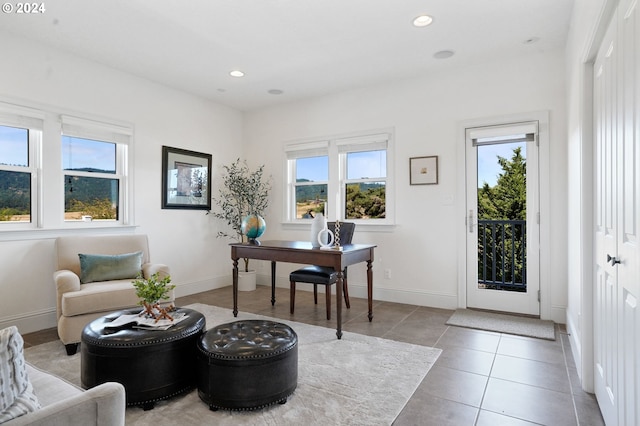 tiled office space featuring recessed lighting and baseboards