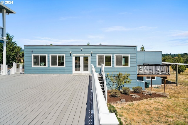 rear view of house with french doors and a deck