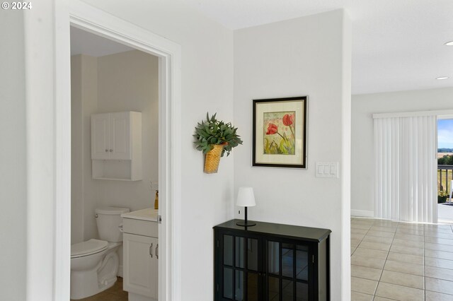 bathroom featuring vanity, toilet, and tile patterned floors