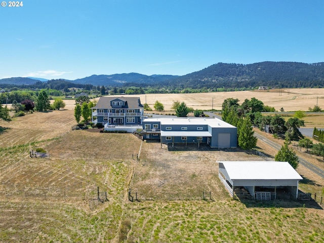 aerial view with a mountain view and a rural view