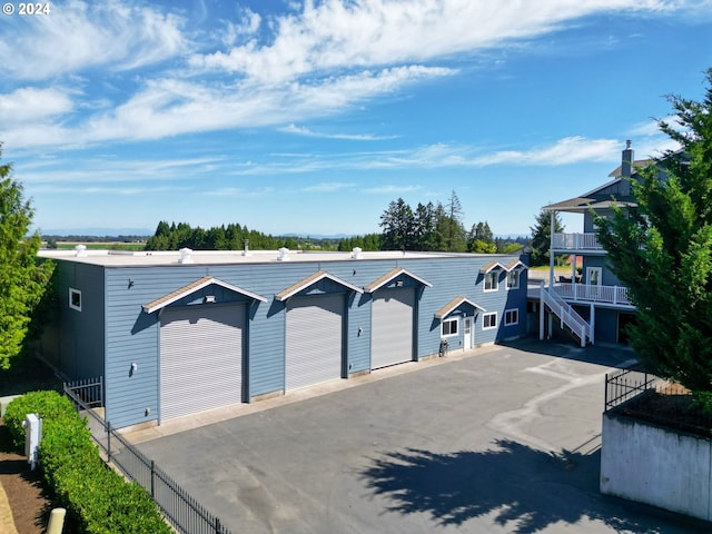 view of front of home featuring fence