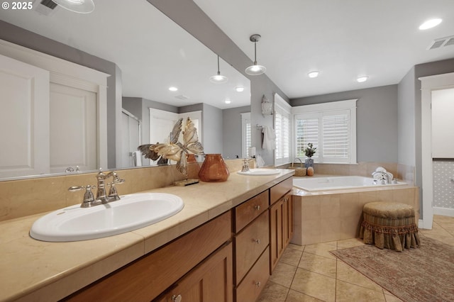 bathroom featuring separate shower and tub, tile patterned flooring, and vanity