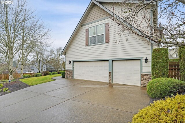 view of side of property featuring a garage