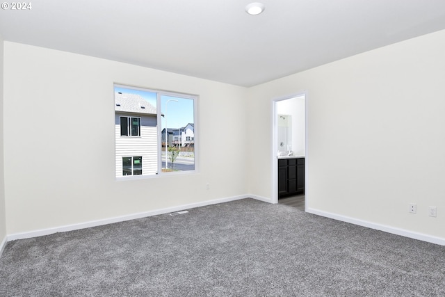 unfurnished room with carpet floors