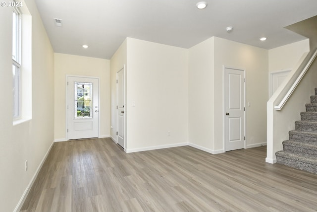 foyer entrance with light wood-type flooring