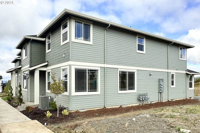 view of side of property featuring cooling unit