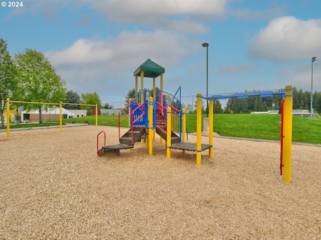 view of playground featuring a lawn