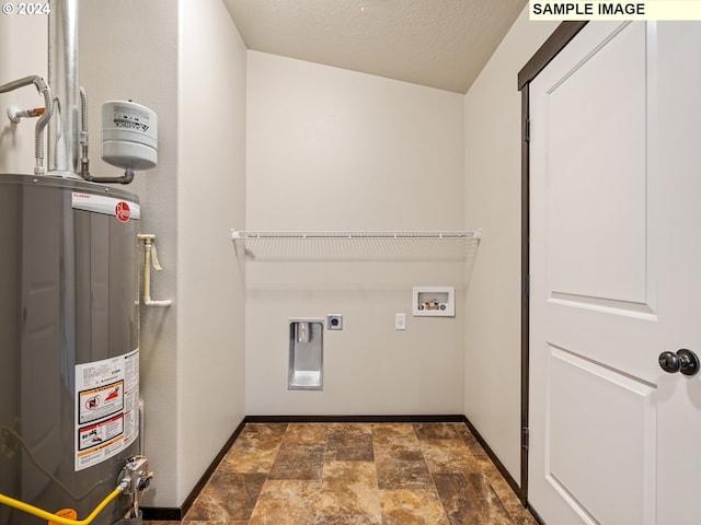 laundry room featuring electric dryer hookup, hookup for a washing machine, a textured ceiling, and gas water heater