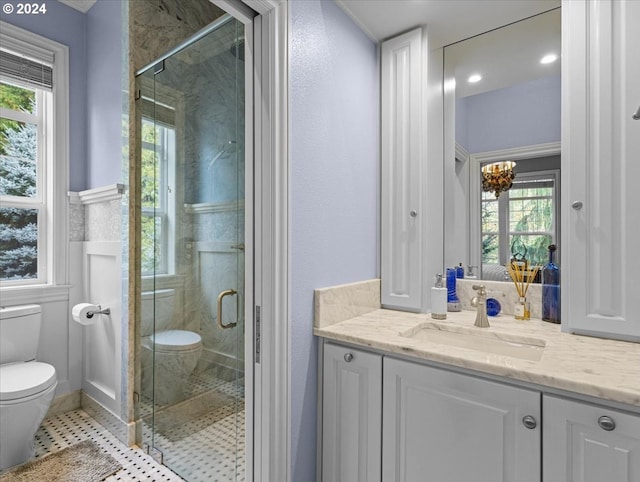 bathroom with a shower with door, toilet, tile patterned floors, vanity, and a chandelier