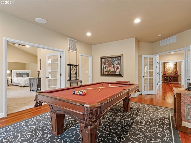 game room featuring hardwood / wood-style floors, lofted ceiling, french doors, and pool table