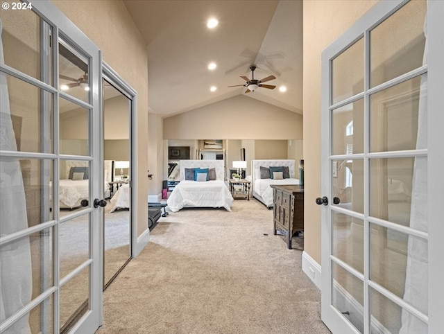 unfurnished bedroom featuring light carpet, french doors, and lofted ceiling