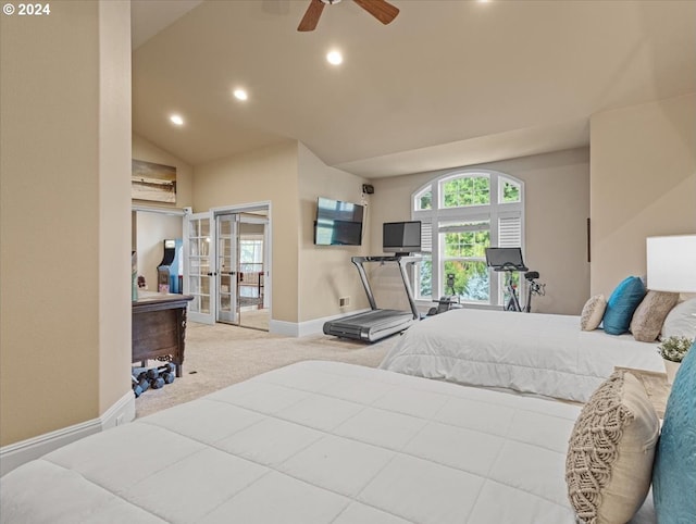 carpeted bedroom with ceiling fan and vaulted ceiling