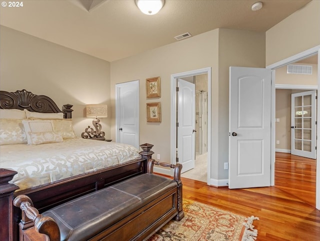 bedroom featuring hardwood / wood-style flooring