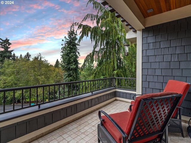 view of balcony at dusk