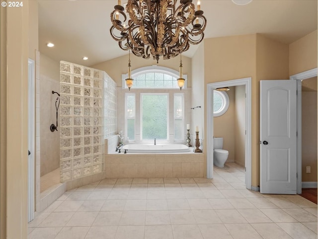 bathroom featuring an inviting chandelier, tile patterned floors, plus walk in shower, and toilet