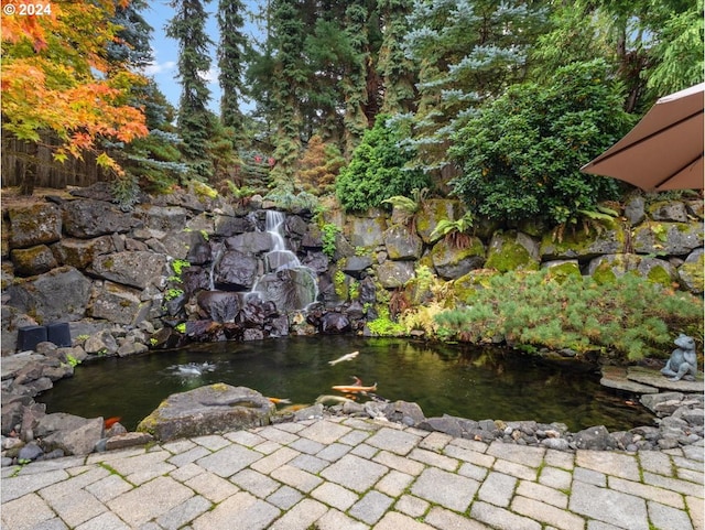 exterior details featuring a small pond