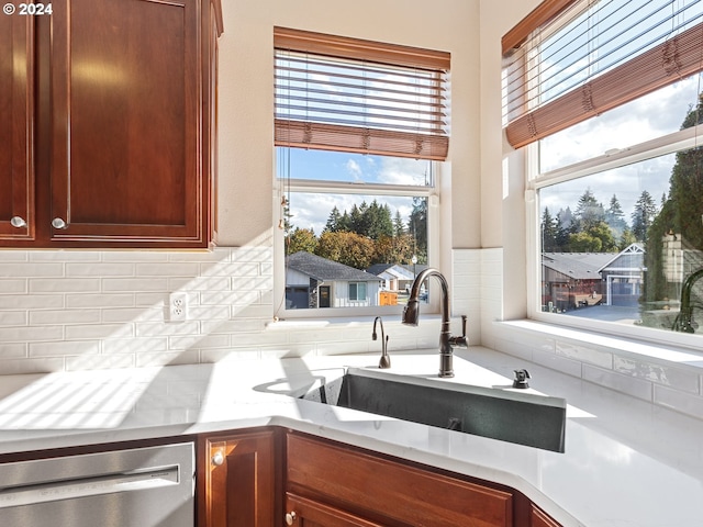 kitchen with dishwashing machine and sink