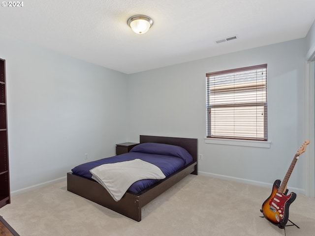 bedroom with light carpet