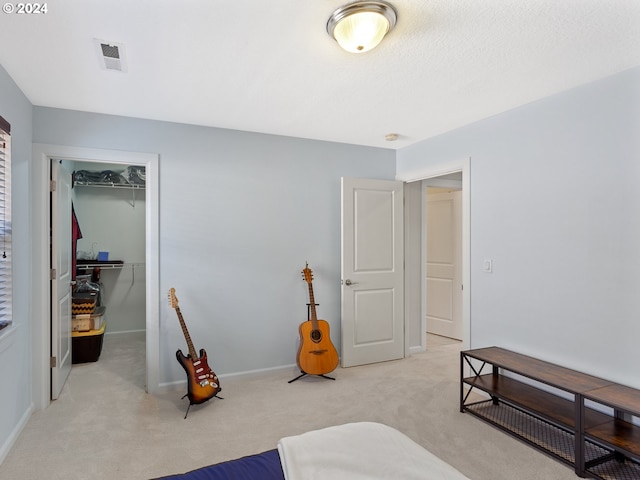 carpeted bedroom featuring a closet