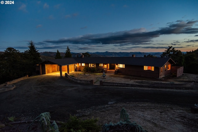 view of front of house featuring a mountain view and a garage