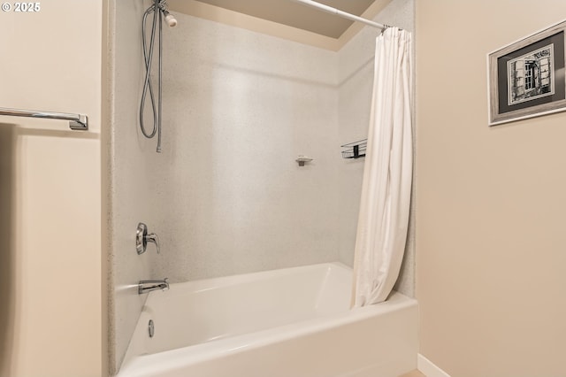 bathroom with shower / tub combo with curtain