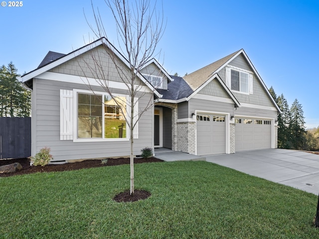 view of front of home featuring a garage and a front lawn