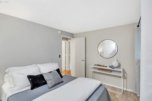 bedroom with light wood-type flooring