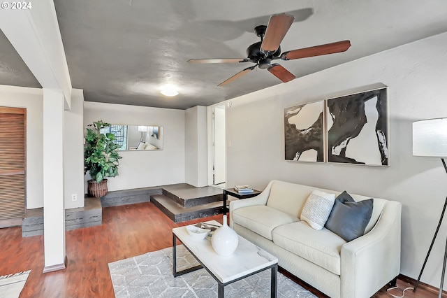 living room featuring dark wood-type flooring