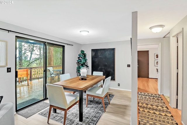 dining room with light wood-type flooring