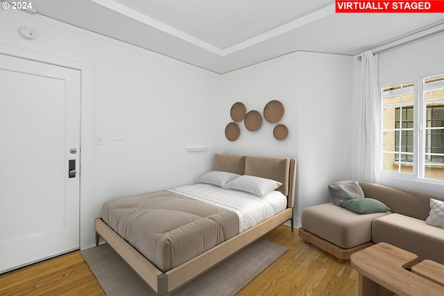 bedroom featuring light wood finished floors