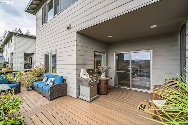 deck featuring an outdoor hangout area and grilling area