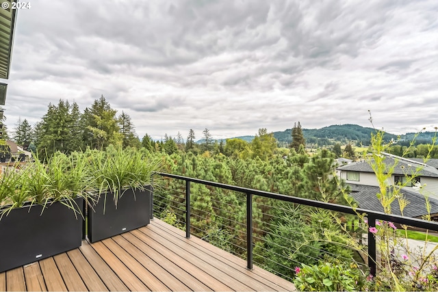 wooden deck with a mountain view