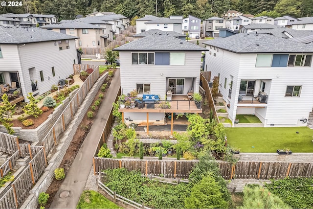 rear view of house with a yard