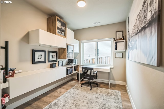 home office featuring light hardwood / wood-style floors