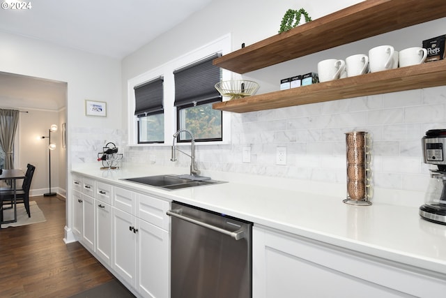 kitchen featuring white cabinetry, dishwasher, sink, dark hardwood / wood-style flooring, and decorative backsplash