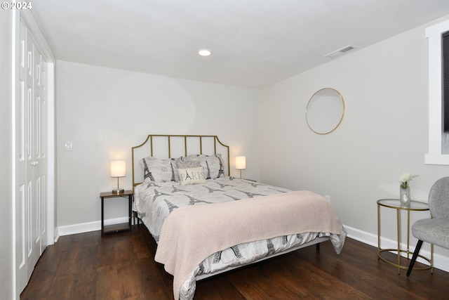 bedroom featuring dark hardwood / wood-style flooring