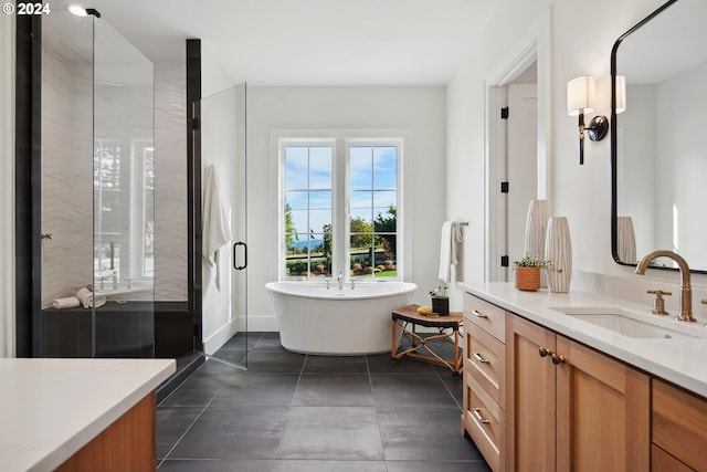 bathroom with vanity, independent shower and bath, and tile patterned flooring