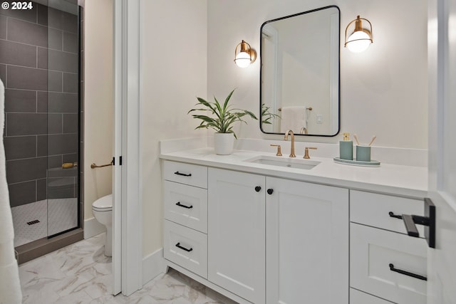 bathroom with vanity, toilet, and an enclosed shower