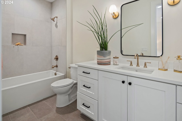 full bathroom with vanity, tile patterned flooring, toilet, and tiled shower / bath