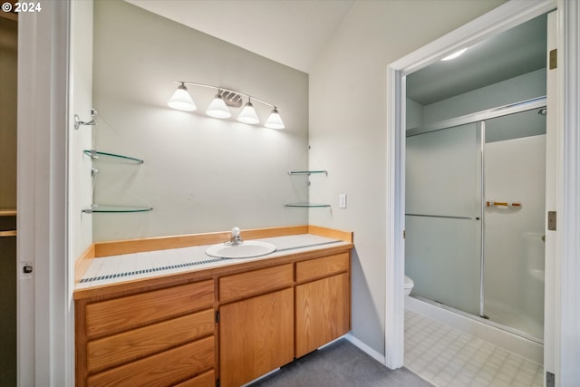 bathroom featuring walk in shower, vanity, toilet, and lofted ceiling