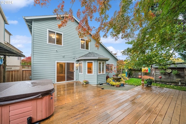 wooden deck with a hot tub