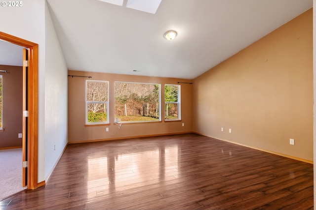 unfurnished living room with vaulted ceiling and dark wood-type flooring