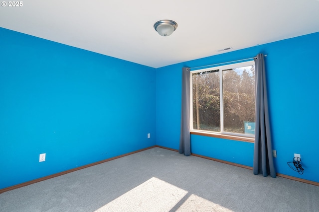 empty room with light colored carpet