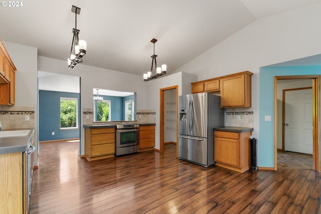 kitchen with lofted ceiling, backsplash, hanging light fixtures, and stainless steel appliances