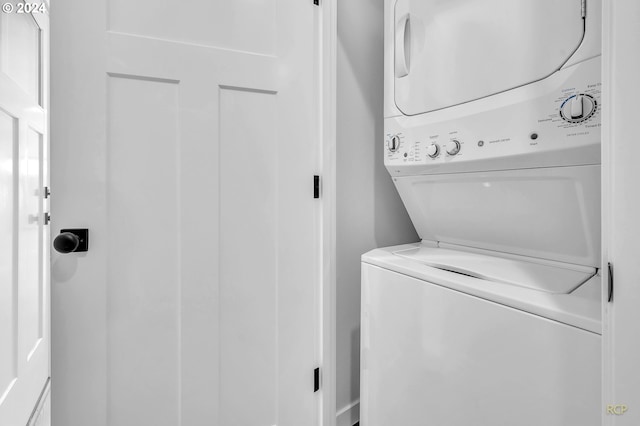 laundry room featuring stacked washer and dryer